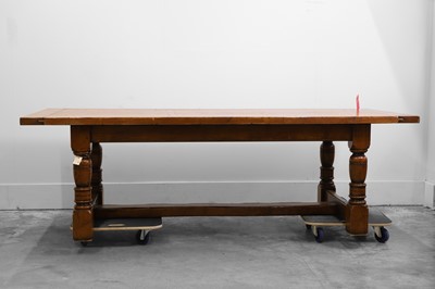 Lot 516 - An oak dining table