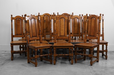 Lot 515 - A set of twelve oak dining chairs