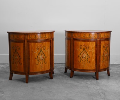 Lot 527 - A pair of stainwood and mahogany painted demilune cabinets