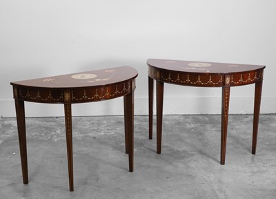 Lot 526 - A pair of mahogany painted console tables