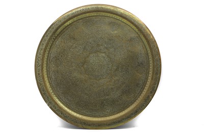 Lot 62 - A Far Eastern brass circular charger