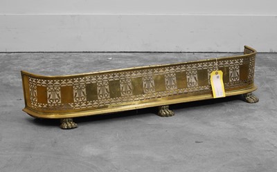 Lot 510 - A Regency brass fire fender