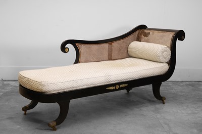 Lot 506 - A Regency ebonised chaise lounge