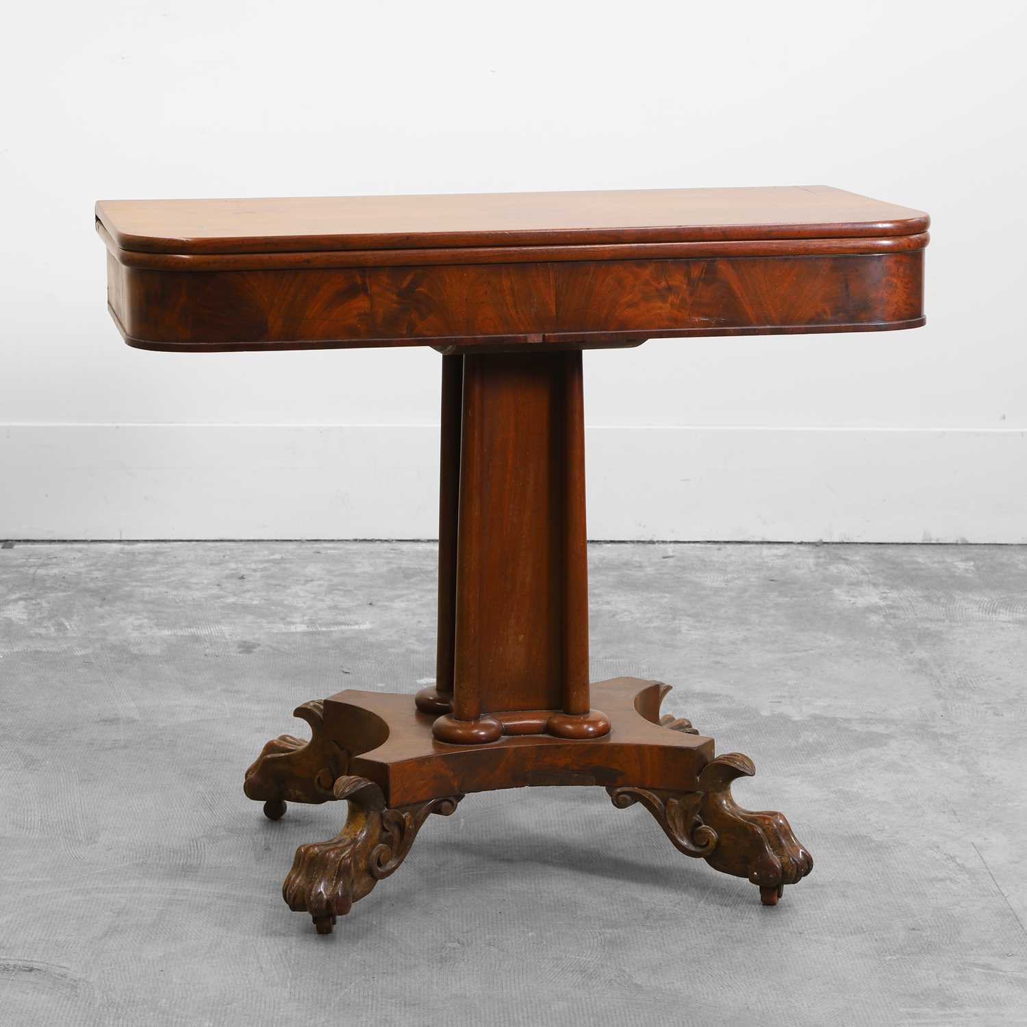 Lot 529 - An early Victorian mahogany fold over tea table