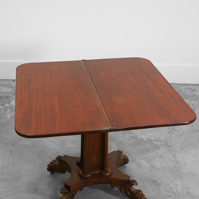 Lot 529 - An early Victorian mahogany fold over tea table