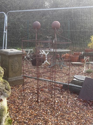Lot 560 - A pair of wrought iron obelisks