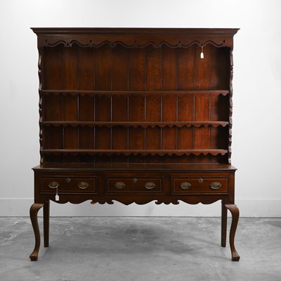 Lot 542 - A George III oak and mahogany crossbanded dresser