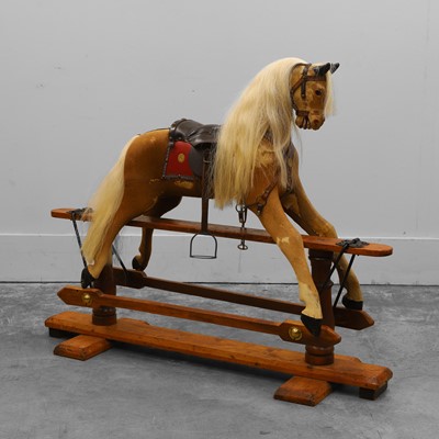 Lot 371 - A hide covered galleried rocking horse