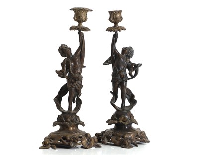 Lot 328 - A pair of bronzed metal figural candlesticks