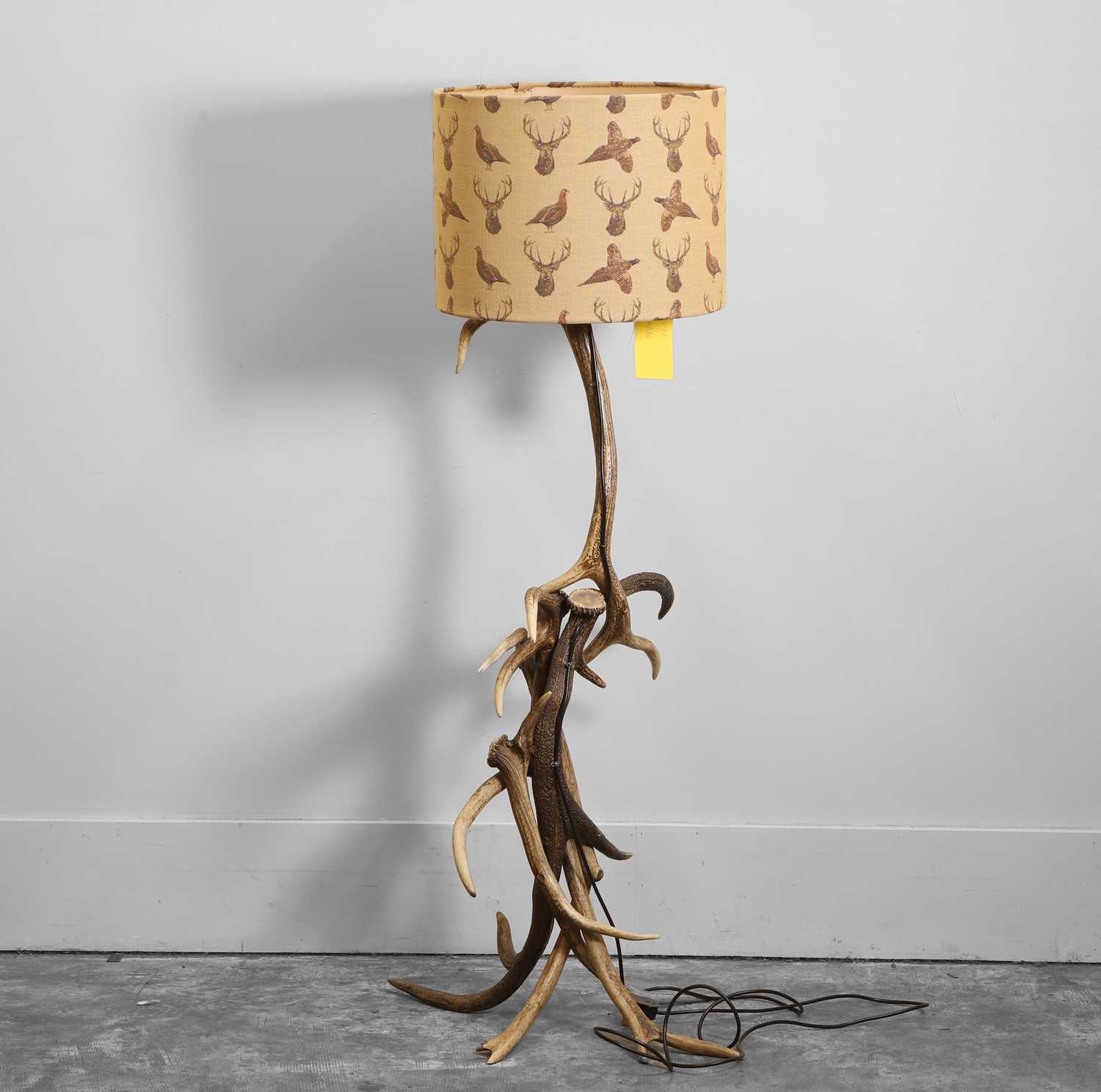 Lot 478 - An antler floor lamp with stag-patterned fabric shade