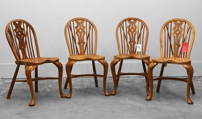 Lot 505A - A set of four elm windsor chairs