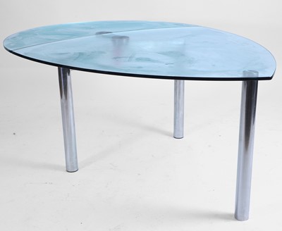 Lot 545 - A chrome and glass table