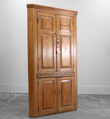 Lot 532 - A George III pine corner cupboard