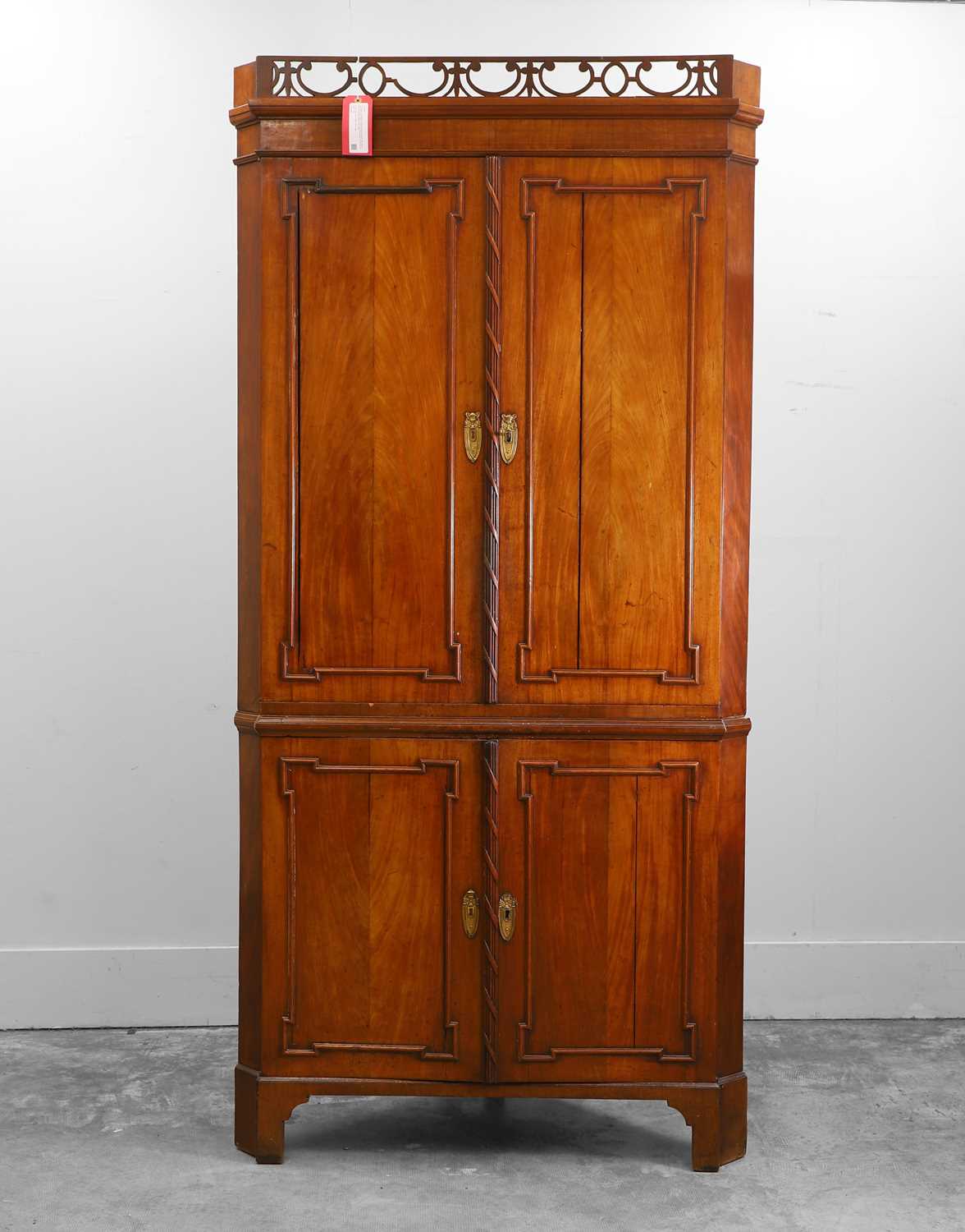 Lot 548A - A George III mahogany standing corner cupboard