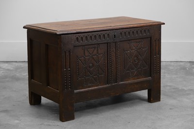 Lot 550 - An oak panelled coffer
