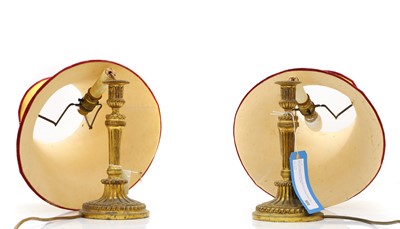 Lot 476 - A pair of ormolu candlesticks