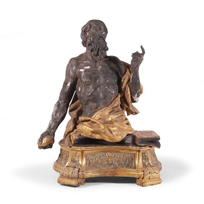 Lot 175 - A carved wooden, ebonised and parcel-gilt figure of Saint Jerome