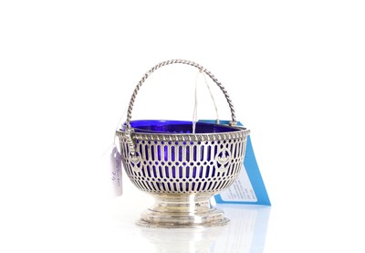 Lot 1 - A silver swing handled sugar bowl