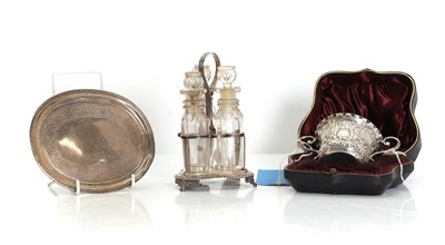 Lot 10 - A silver three bottle cruet stand