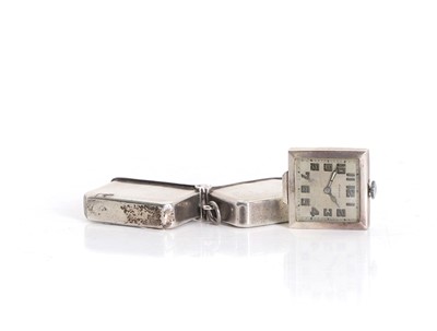 Lot 6 - A small silver cased travel clock