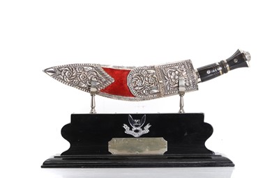 Lot 381 - A Gurkha kukri and scabbard on presentation stand