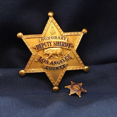 Lot 302 - An Honorary Deputy Sheriff Los Angeles County gilt-metal badge