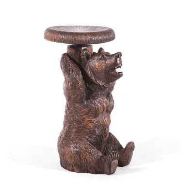 Lot 80 - A carved linden wood Black Forest piano stool