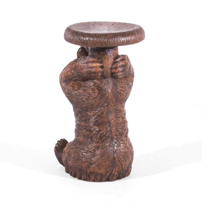 Lot 80 - A carved linden wood Black Forest piano stool