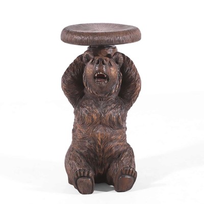 Lot 80 - A carved linden wood Black Forest piano stool