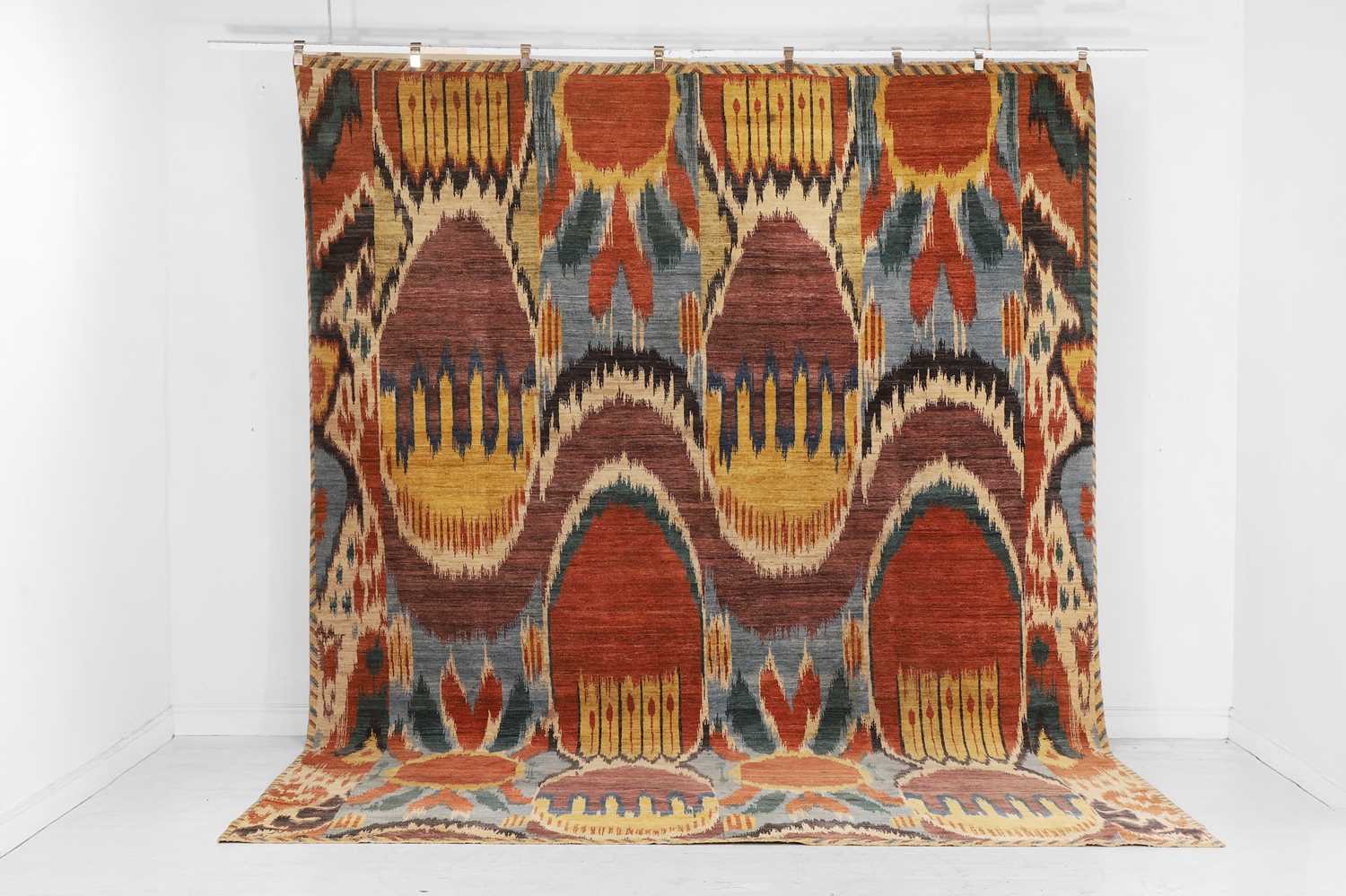 Lot A wool carpet of Ikat design