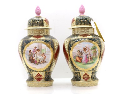 Lot 114 - A pair of Vienna porcelain jars and covers