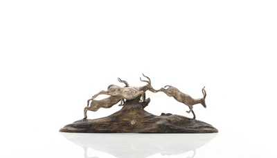 Lot 12 - A silver and wood model of leaping impalas