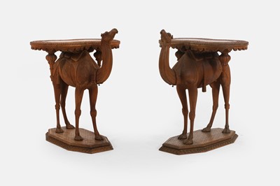 Lot A pair of teak camel occasional tables