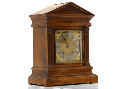 Lot 202 - An oak cased mantle clock