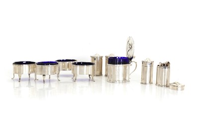 Lot 35 - A silver cased set of salts and mustards