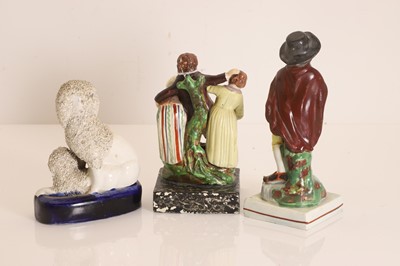 Lot 101 - Three Staffordshire pottery figures