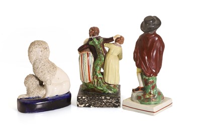 Lot 101 - Three Staffordshire pottery figures