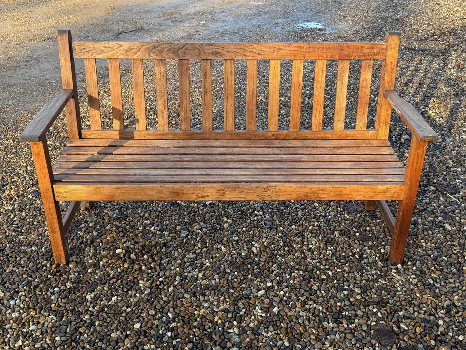 Lot 554 - A teak bench