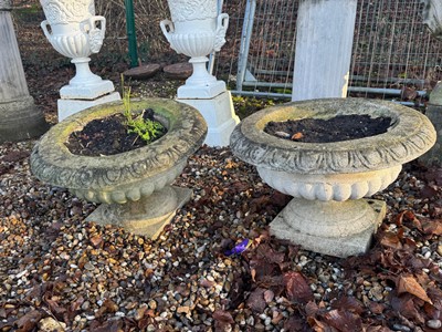 Lot 561 - A pair of reconstituted garden planters