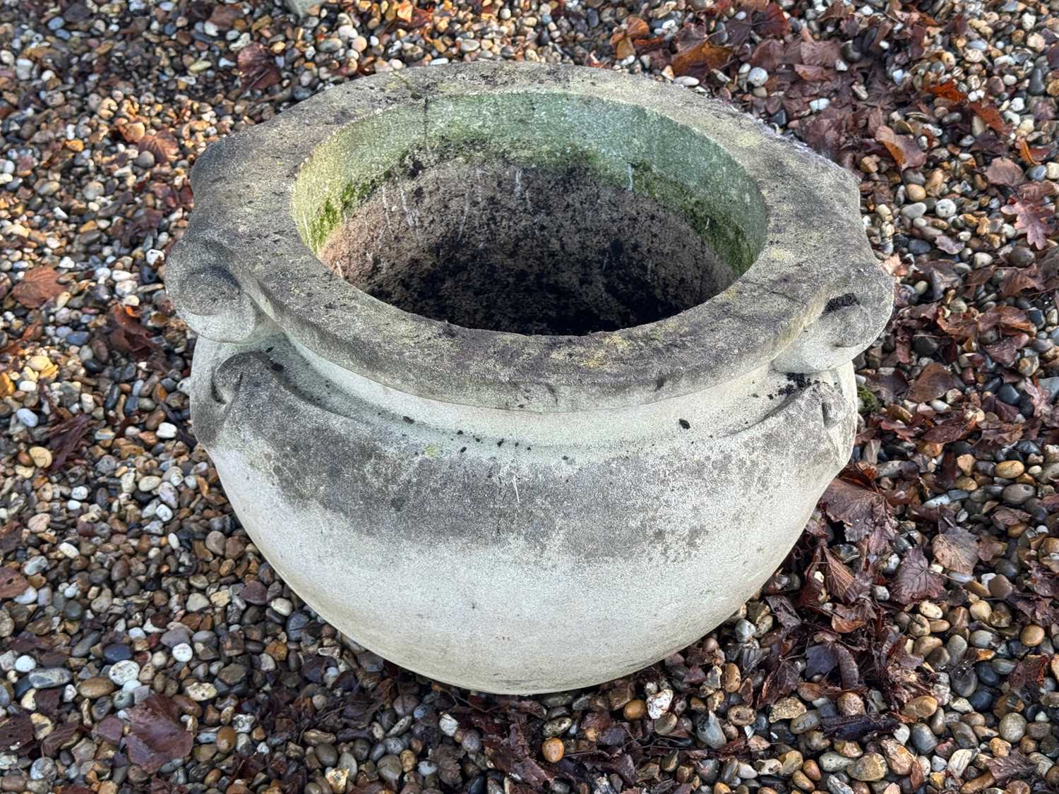 Lot 557 - A reconstituted garden urn