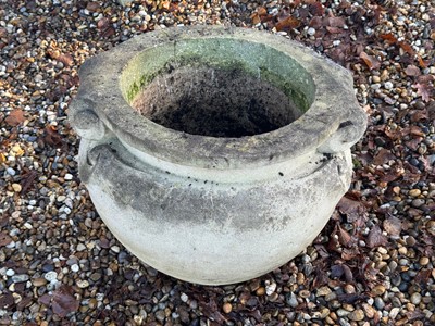 Lot 557 - A reconstituted garden urn