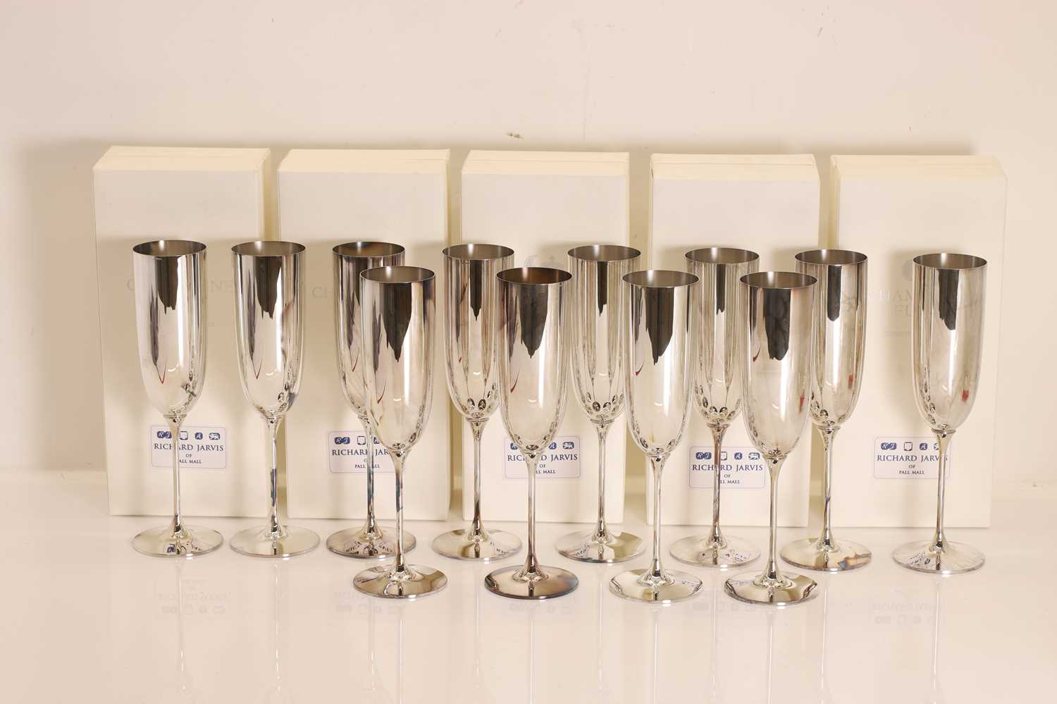 Lot 5 - A collection of twelve silver champagne flutes