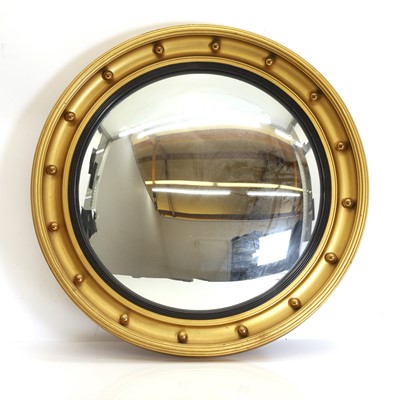 Lot 491 - A gilded convex mirror