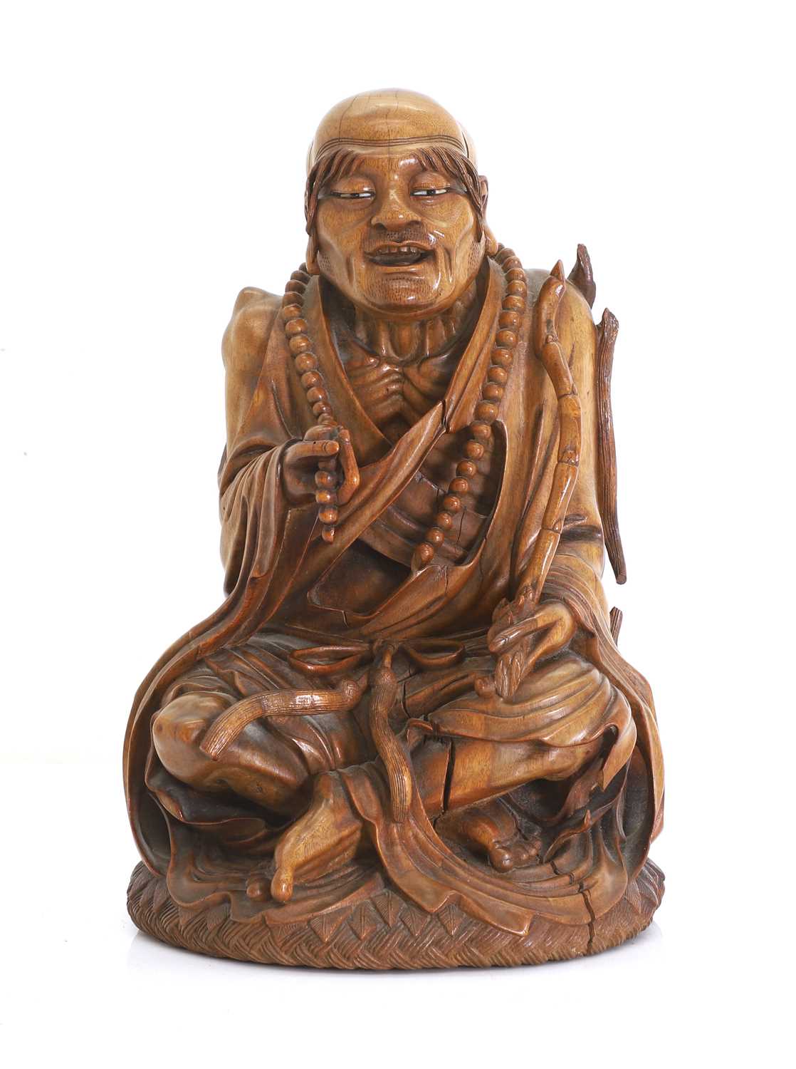 Lot 60 - A Chinese wooden carving of an emaciated Buddhist monk