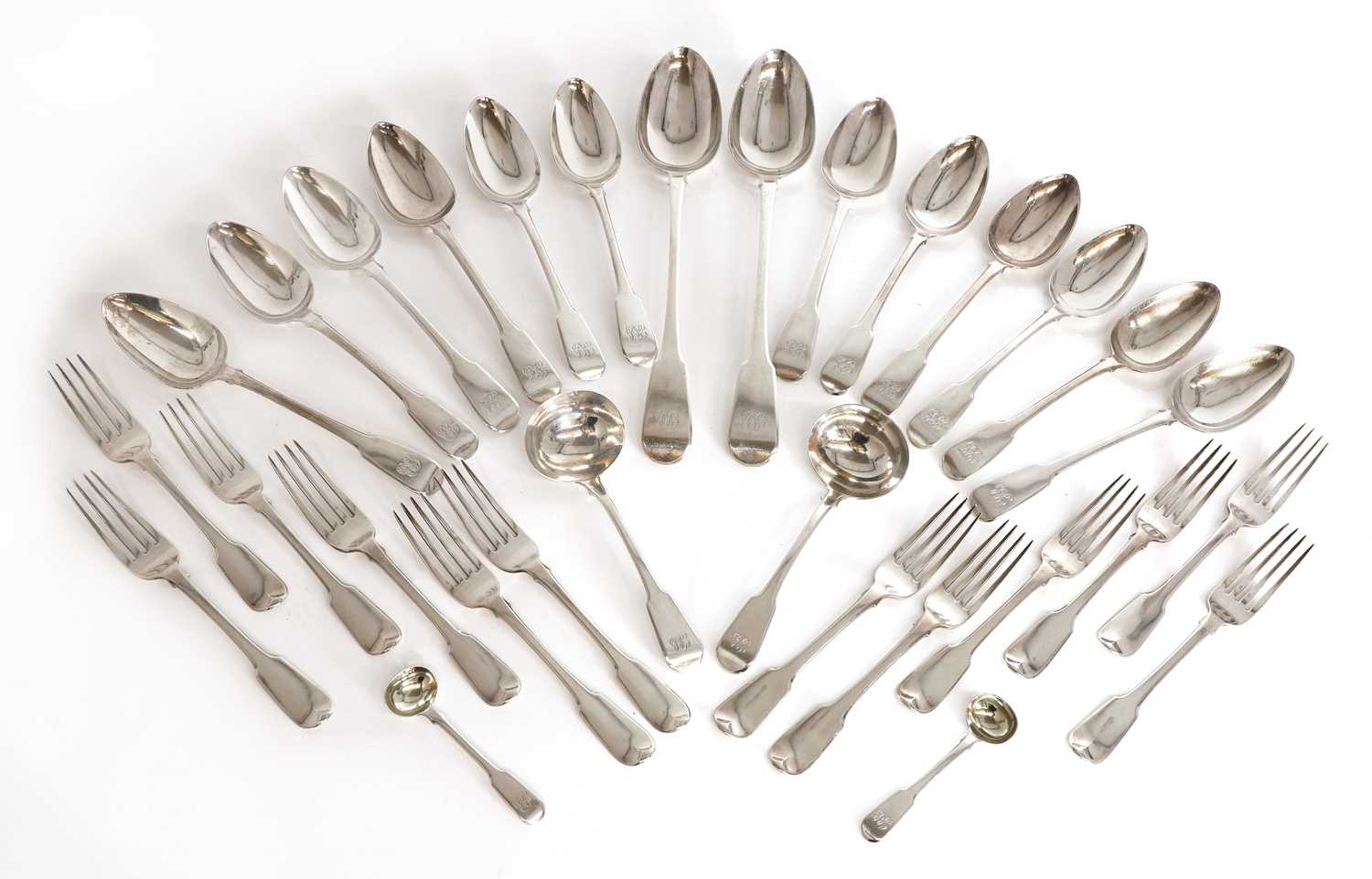 Lot 31 - Twelve silver fiddle pattern table spoons and twelve fiddle pattern table forks
