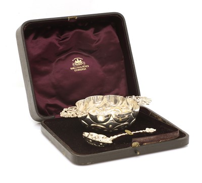 Lot 43 - A silver twin handled sugar bowl, and spoon