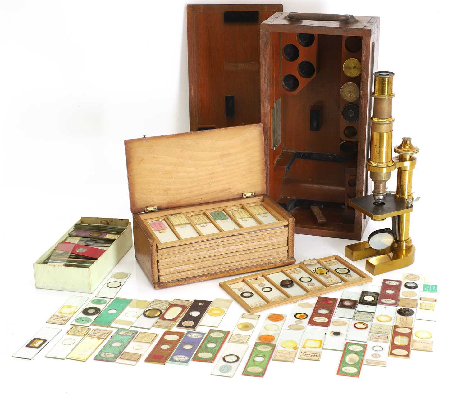 Lot 306 - A lacquered brass monocular microscope, with two boxes of slides